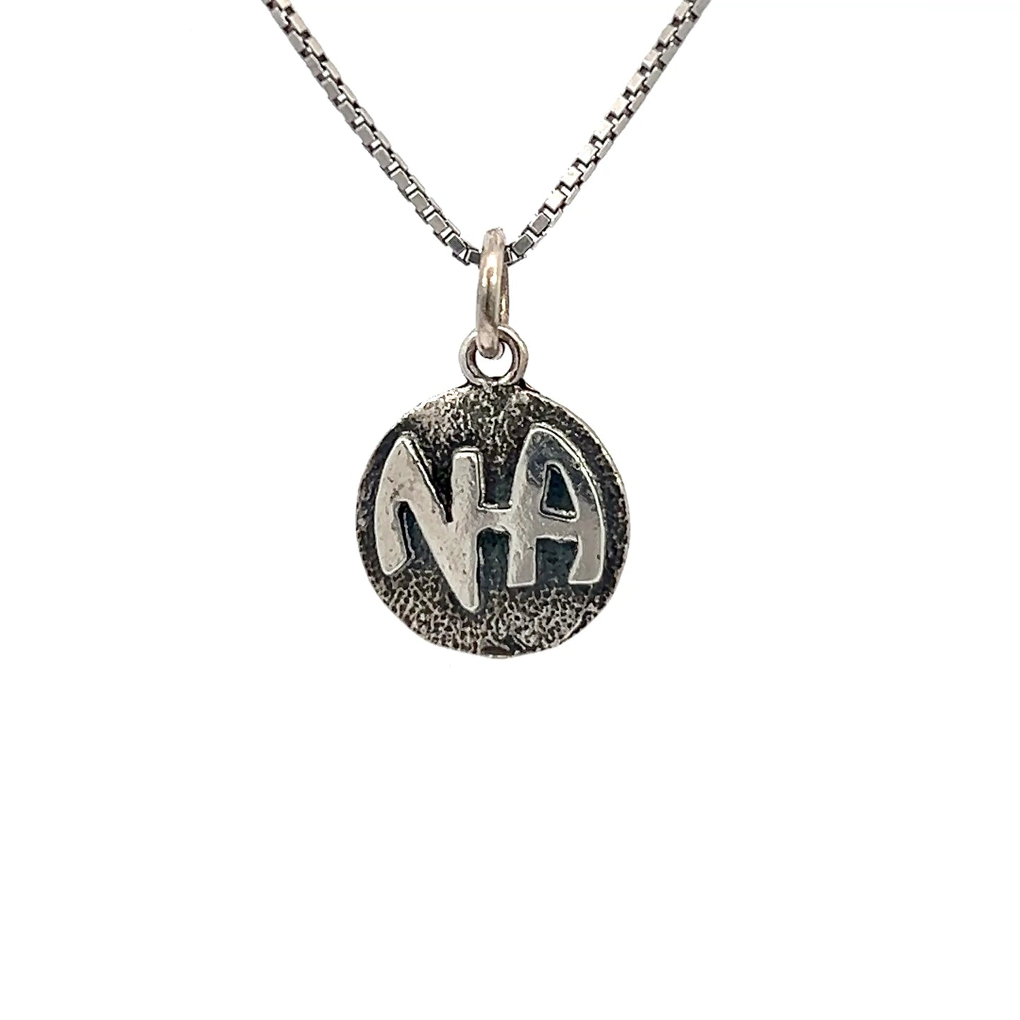 Sterling Silver Pendant, Narcotics Anonymous NA Initials in a Solid Textured Coin Style Circle, Medium Size