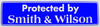 "Protected by Smith & Wilson" Bumper Sticker, Available in 3 Colors, Size 11-1/2" x 3"